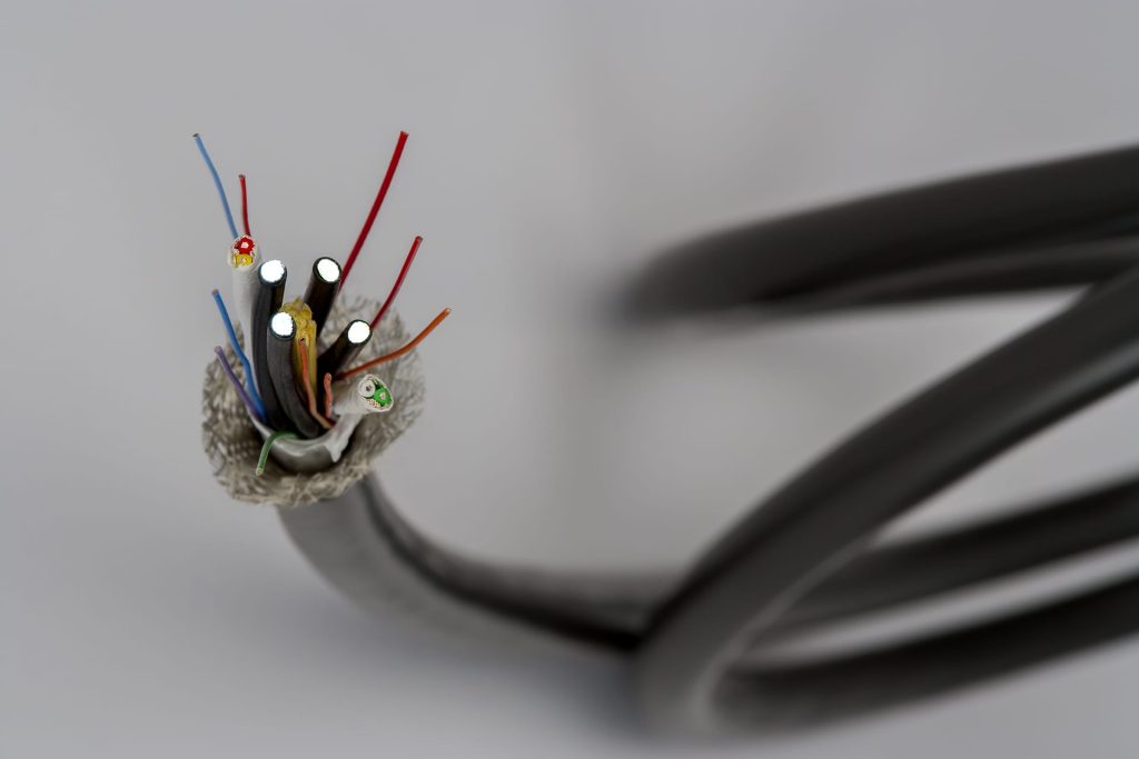 multi-conductor cable with fiber optics included within the cable