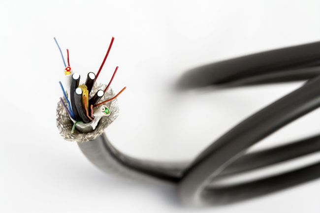 multi-conductor cable with fiber optic cables incorporated with it