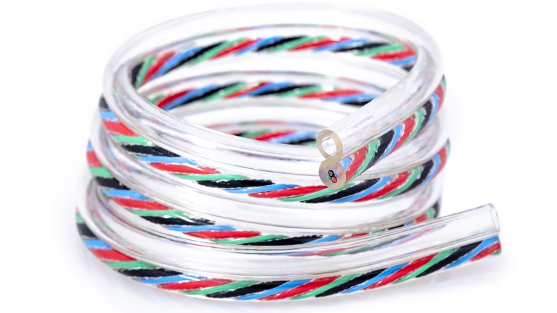 coil of tubing with one clear leg and one leg with conductors in it